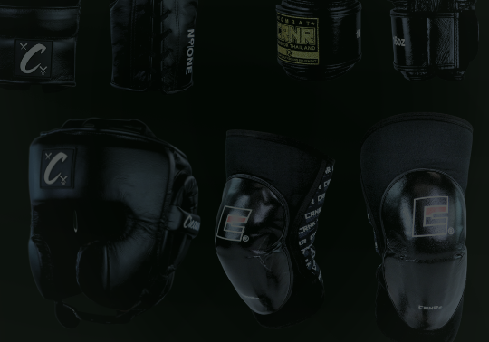 A product display of black combat sports gear from Combat Corner against a dark background, including boxing gloves, headgear, and knee pads.