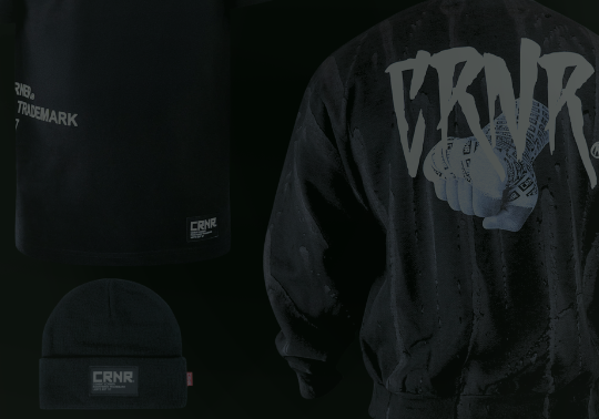 A product display of black combat sports gear from Combat Corner against a dark background, including t-shirts, beanies, fight shorts, and crewnecks. 