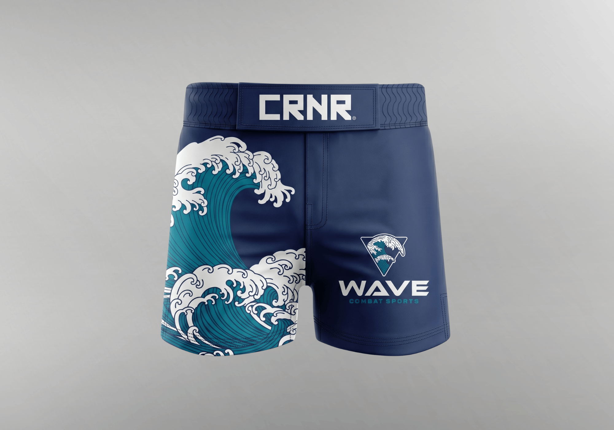 A custom pair of navy blue MMA grappling shorts by Combat Corner, featuring a large Japanese-style ocean wave graphic on the right leg and "WAVE COMBAT SPORTS" branding on the left leg.