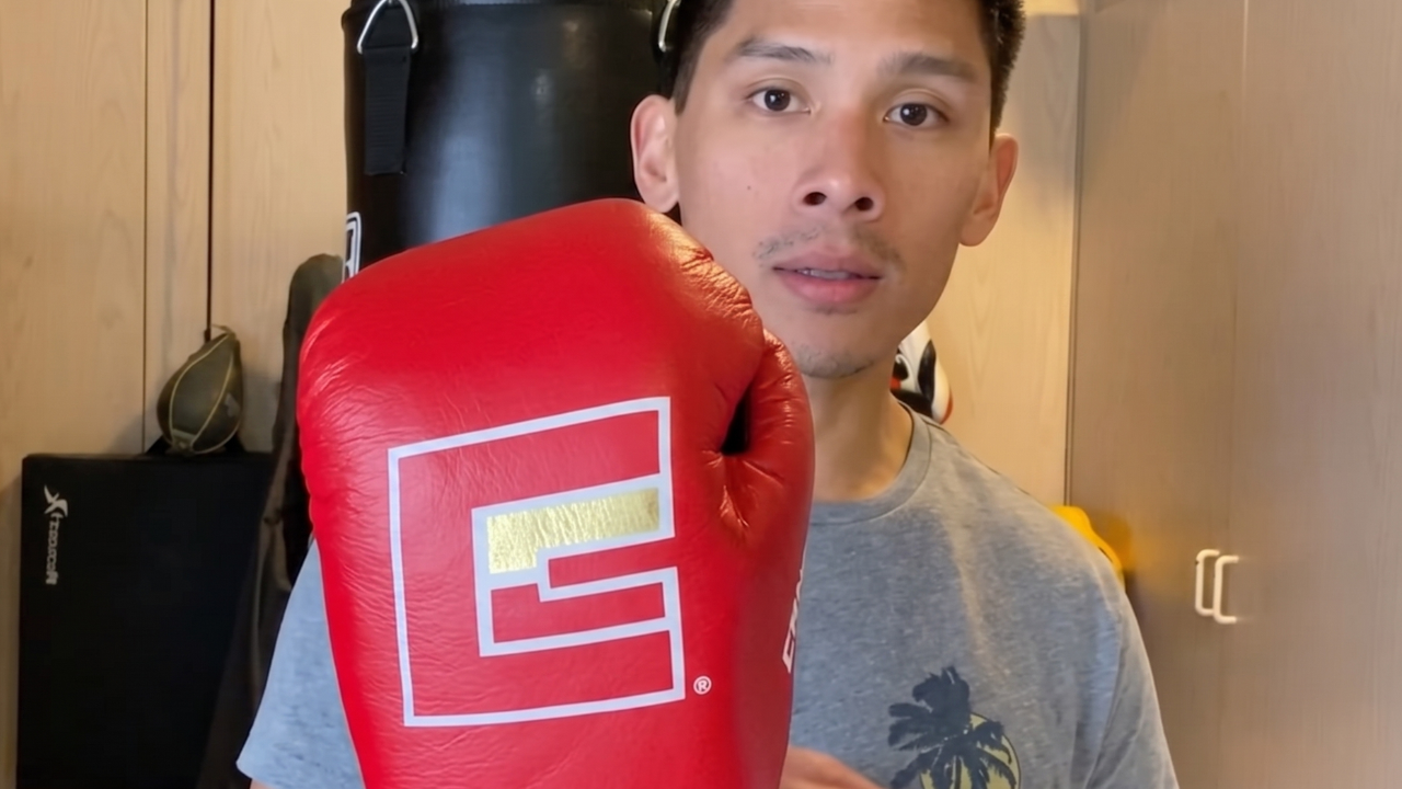 YouTube thumbnail combat gear reviewer influencer giving a product review of the HMIT Punchers Boxing Gloves. 