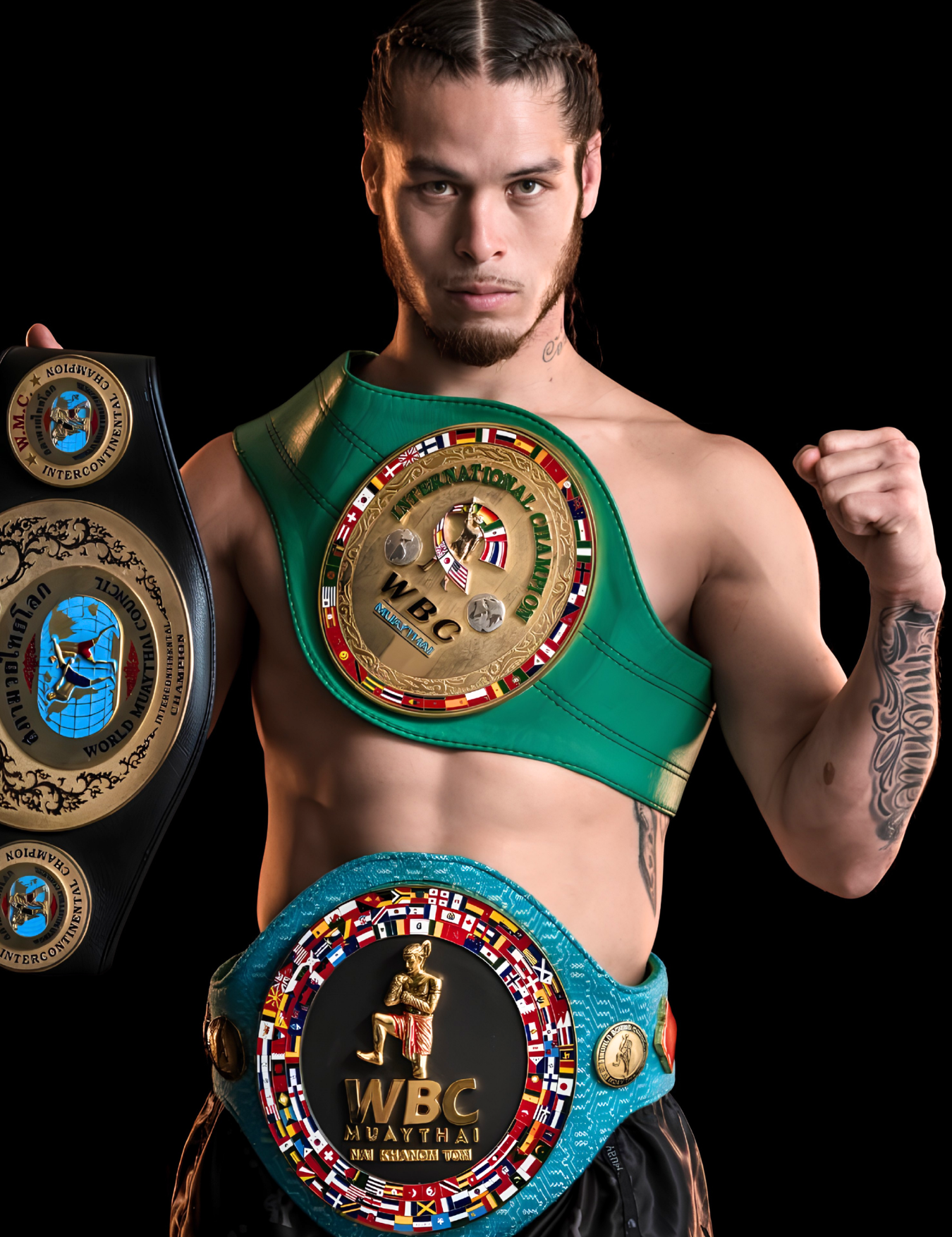 Studio portrait of a shirtless ONE World Champion and Combat Corner Pro Team Member Eddie Abasolo with braided hair, flexing his left arm while proudly displaying three major championship belts, including a green WBC International Champion belt and black Combat Corner fight shorts. 
