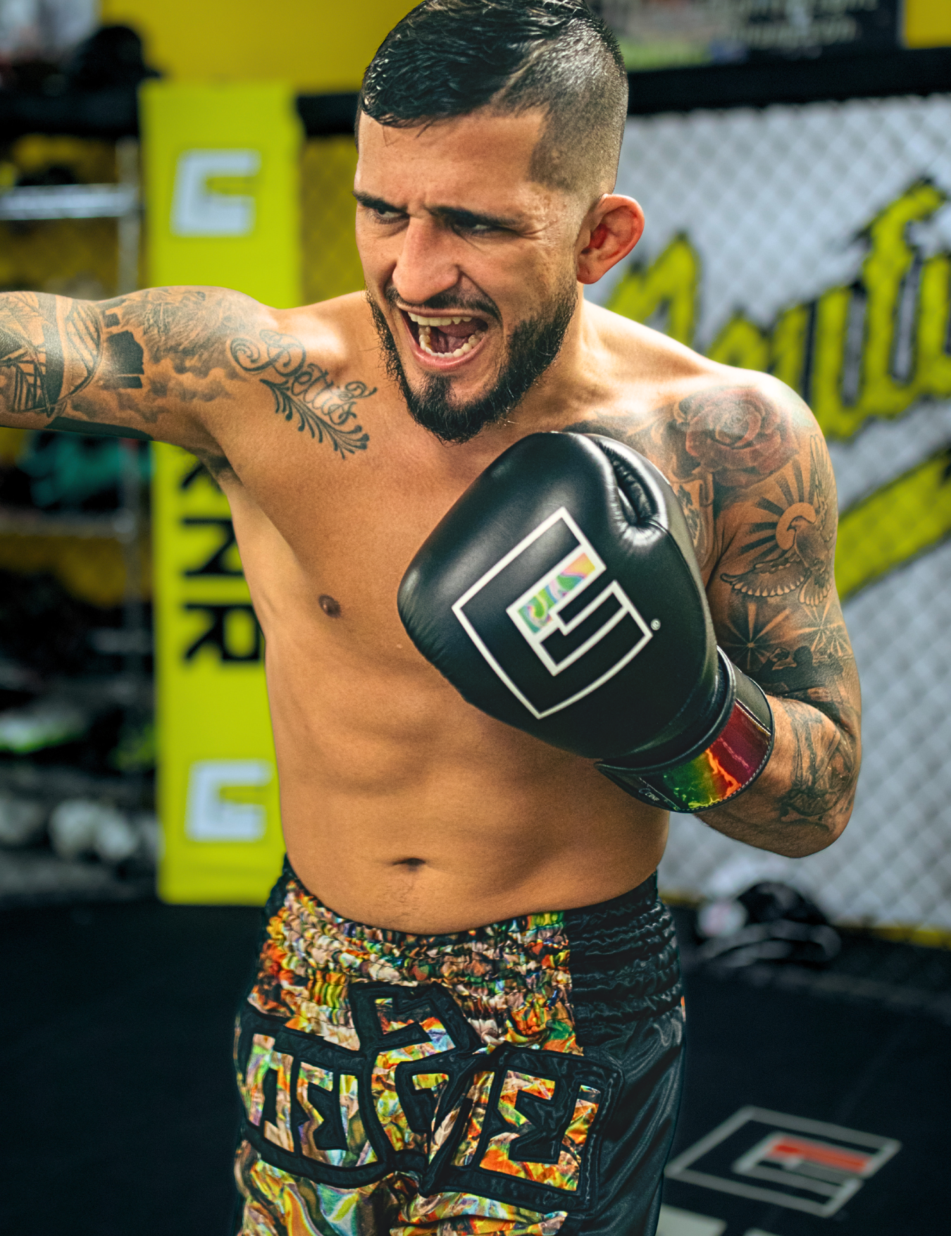 CRNR Pro Team Member Sergio Pettis training with Combat Corner's Jumbo Muay Thai Shorts and HMIT Boxing Gloves. 
