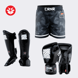 Photo example of the Combat Corner HWD Iso Bundle featuring HWD Boxing Gloves, HWD Shin Guards, and deluxe IsoSuture Fight Shorts.