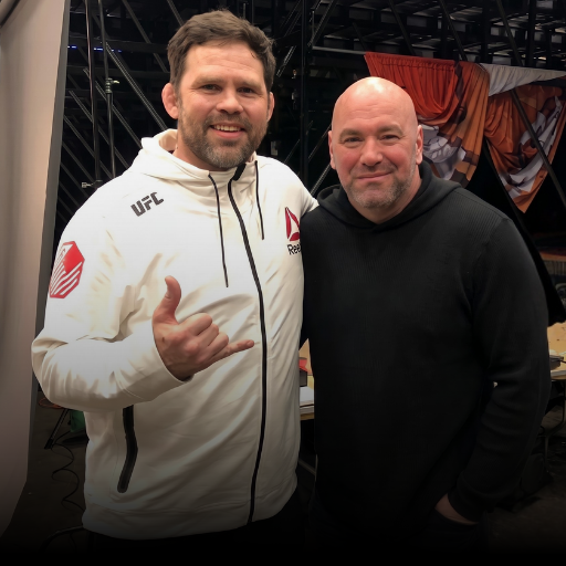 A photo of Combat Corner customer and MMA veteran Tim Credeur standing next to UFC CEO Dana White, smiling together at an indoor event.
