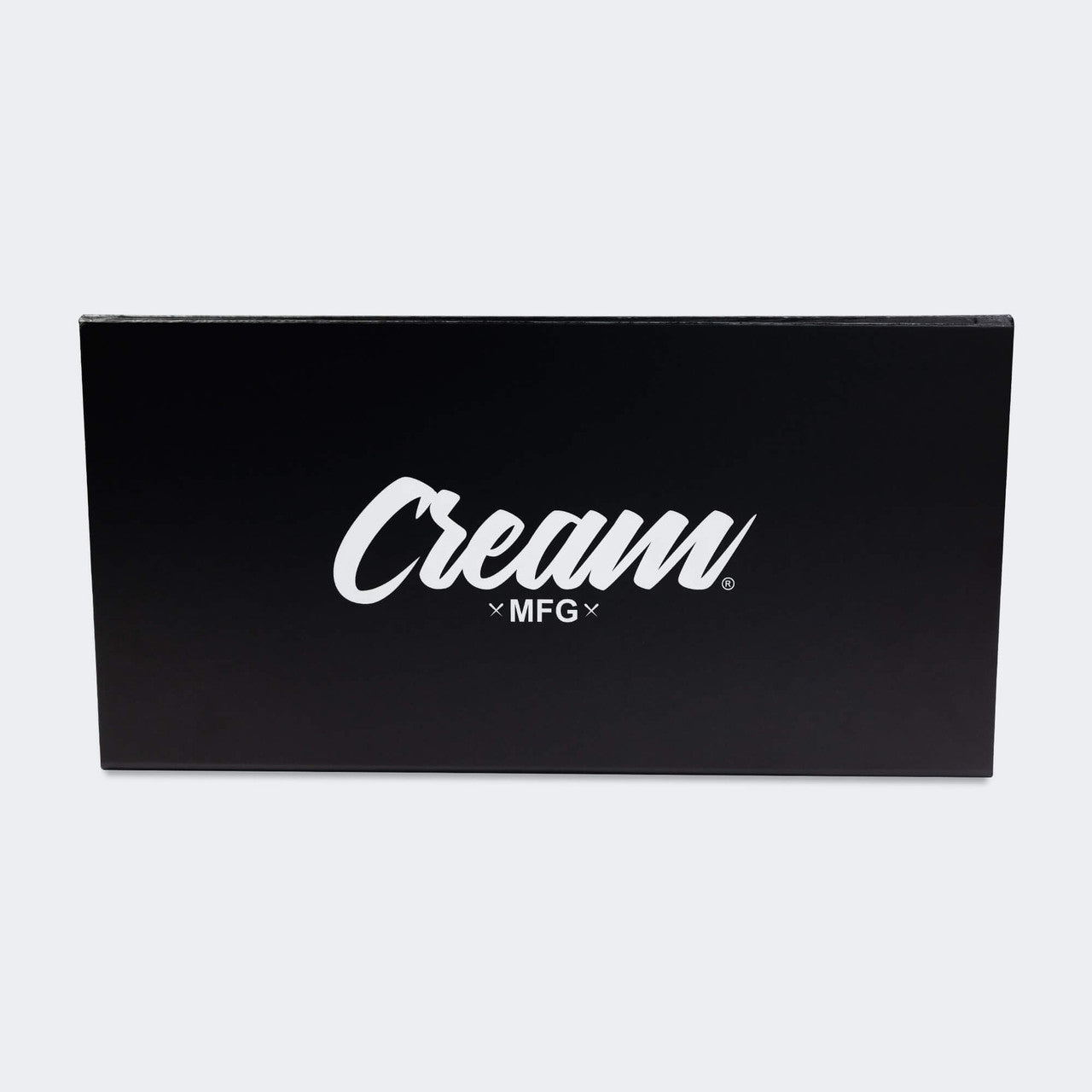Photo of the back closed side of the premium packaging of Combat Corner's black Cream TM1 Competition Boxing Gloves, which are Japanese inspired Mexican Boxing Gloves that are hand made in Thailand.