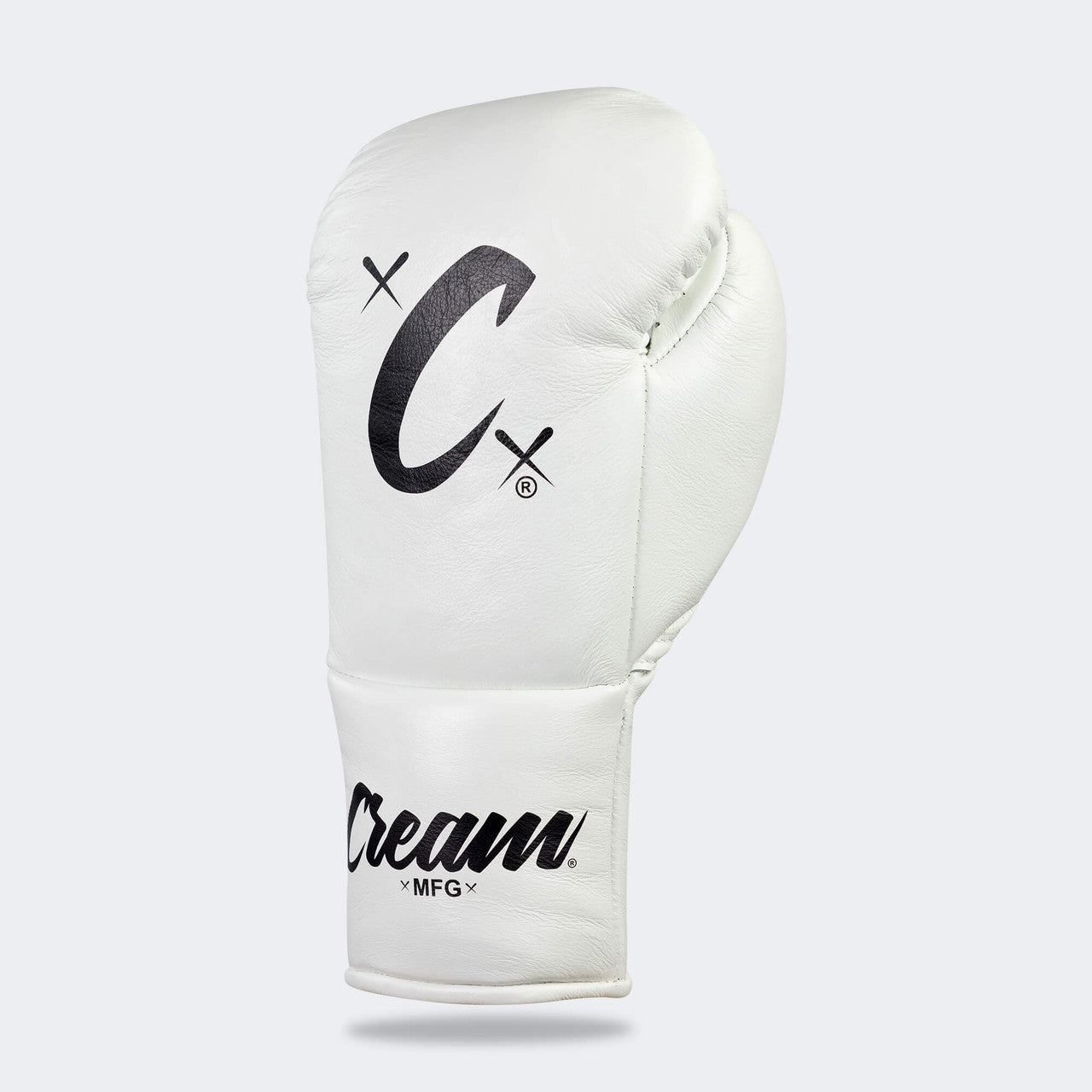 Photo of the front left side of Combat Corner's white Cream TM1 Competition Boxing Gloves, which are Japanese inspired Mexican Boxing Gloves that are hand made in Thailand.