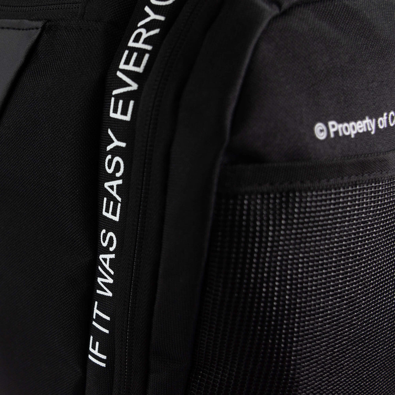 Closeup detail product photo of the special text stitching on Combat Corner's Essential Gear Bag