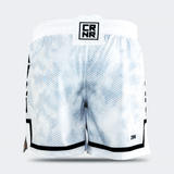 Rear view of the white Combat Corner hybrid fight shorts against a light grey background. The back displays the continuous hexagonal digital camo pattern, a square black and white "CRNR" logo patch on the center of the waistband, and a small black "CRNR" logo printed near the lower right hem.