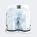 Rear view of the white Combat Corner hybrid fight shorts against a light grey background. The back displays the continuous hexagonal digital camo pattern, a square black and white "CRNR" logo patch on the center of the waistband, and a small black "CRNR" logo printed near the lower right hem.