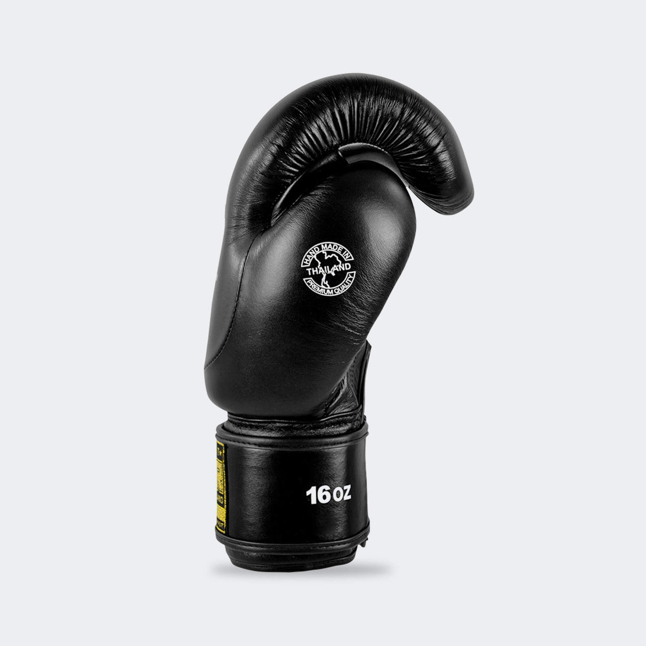 A product photo of Combat Corner's black HMIT Boxing Gloves. The photo shows the left side of CRNR HMIT black Boxing Gloves. These black HMIT Boxing Gloves come in 12 once gloves, 14 once gloves, and 16 once gloves. These black Combat Corner HMIT Boxing Gloves work for multiple striking combat sports. These gloves can be used as Muay Thai Gloves, Boxing Gloves, Thai Boxing Gloves, Sparring Gloves, and more.