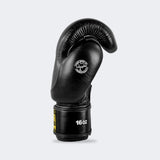 A product photo of Combat Corner's black HMIT Boxing Gloves. The photo shows the left side of CRNR HMIT black Boxing Gloves. These black HMIT Boxing Gloves come in 12 once gloves, 14 once gloves, and 16 once gloves. These black Combat Corner HMIT Boxing Gloves work for multiple striking combat sports. These gloves can be used as Muay Thai Gloves, Boxing Gloves, Thai Boxing Gloves, Sparring Gloves, and more.