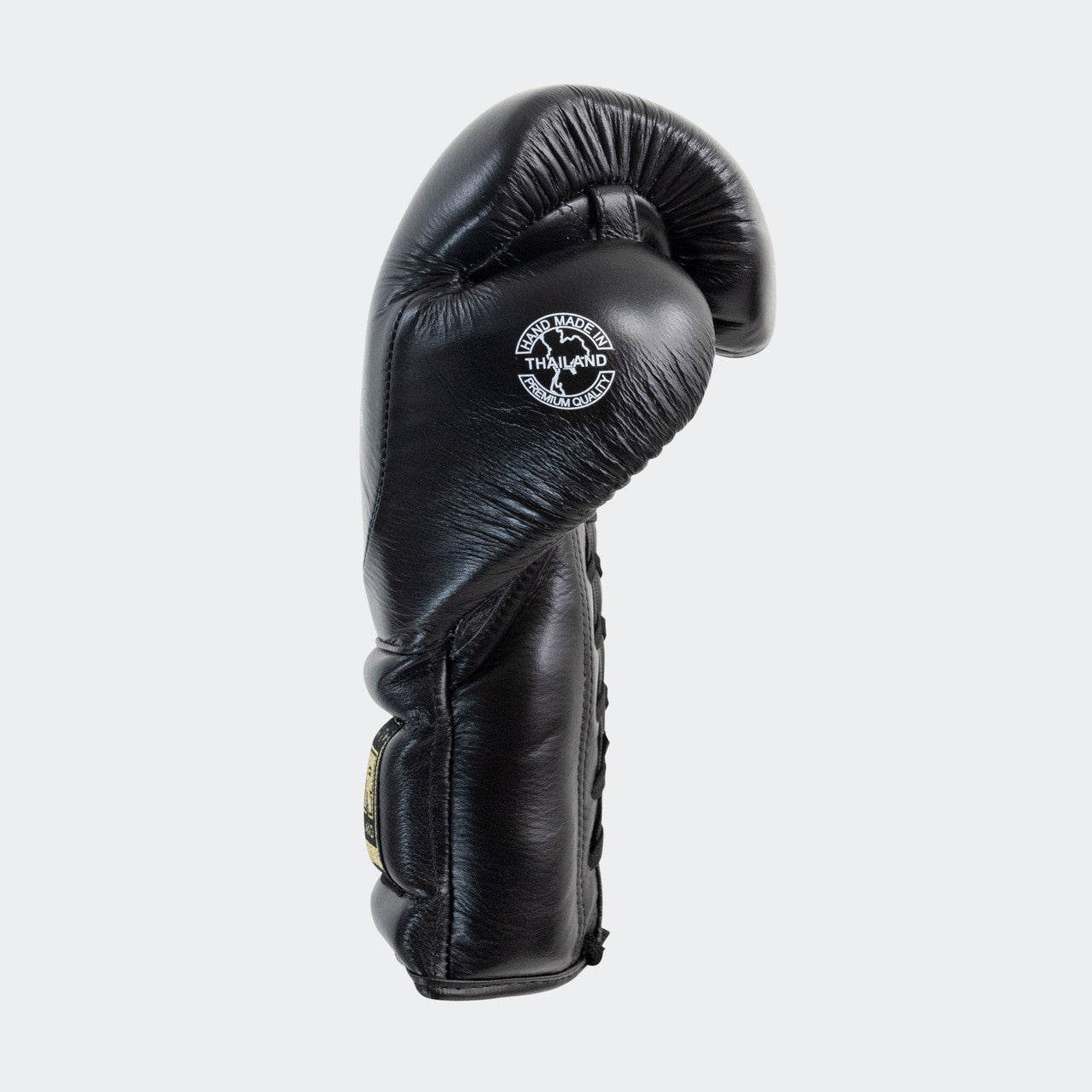 Photo of the left side of Combat Corner's black HMIT Lace Up Sparring Gloves, which are Mexican Boxing Gloves that are hand made in Thailand.
