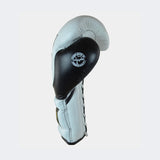 Photo of the left side of Combat Corner's white and black HMIT Lace Up Sparring Gloves, which are Mexican Boxing Gloves that are hand made in Thailand.