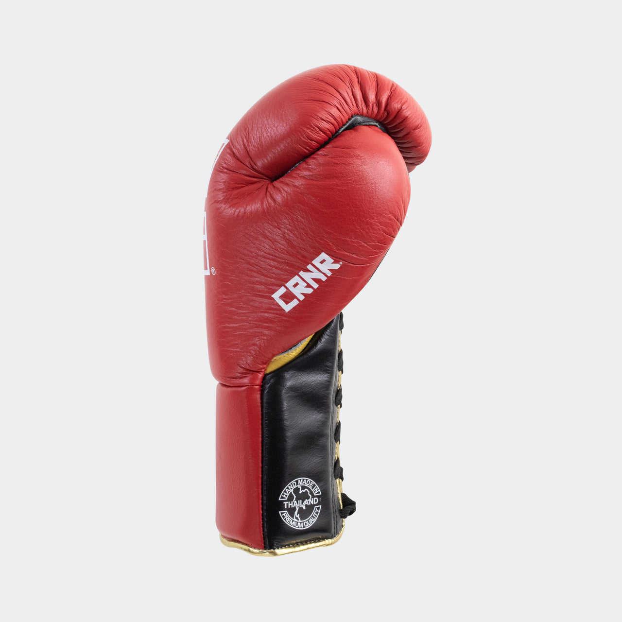 Photo of the left side of Combat Corner's red Punchers Professional Fight Gloves, which are Mexican Boxing Gloves that are hand made in Thailand.