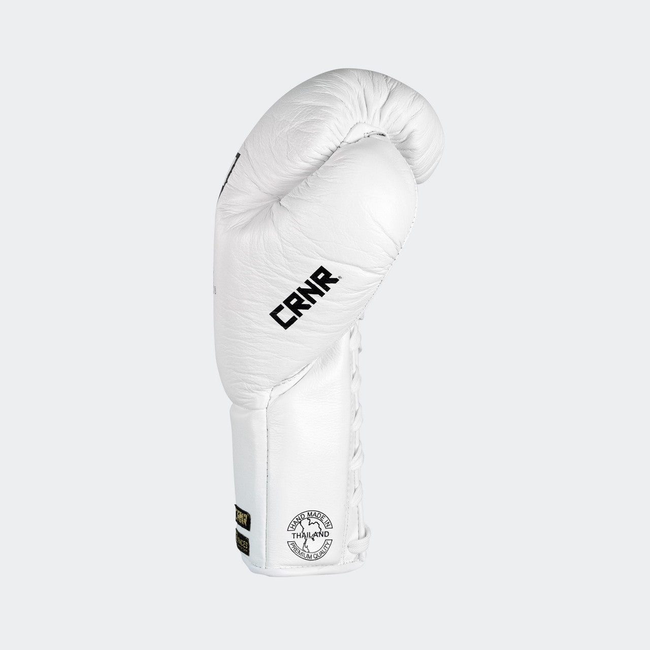 Photo of the left side of Combat Corner's white Punchers Professional Fight Gloves, which are Mexican Boxing Gloves that are hand made in Thailand.
