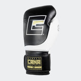 Photo of the front left side of Combat Corner's black and white HMIT Velcro Sparring Gloves, which are Mexican Boxing Gloves that are hand made in Thailand.