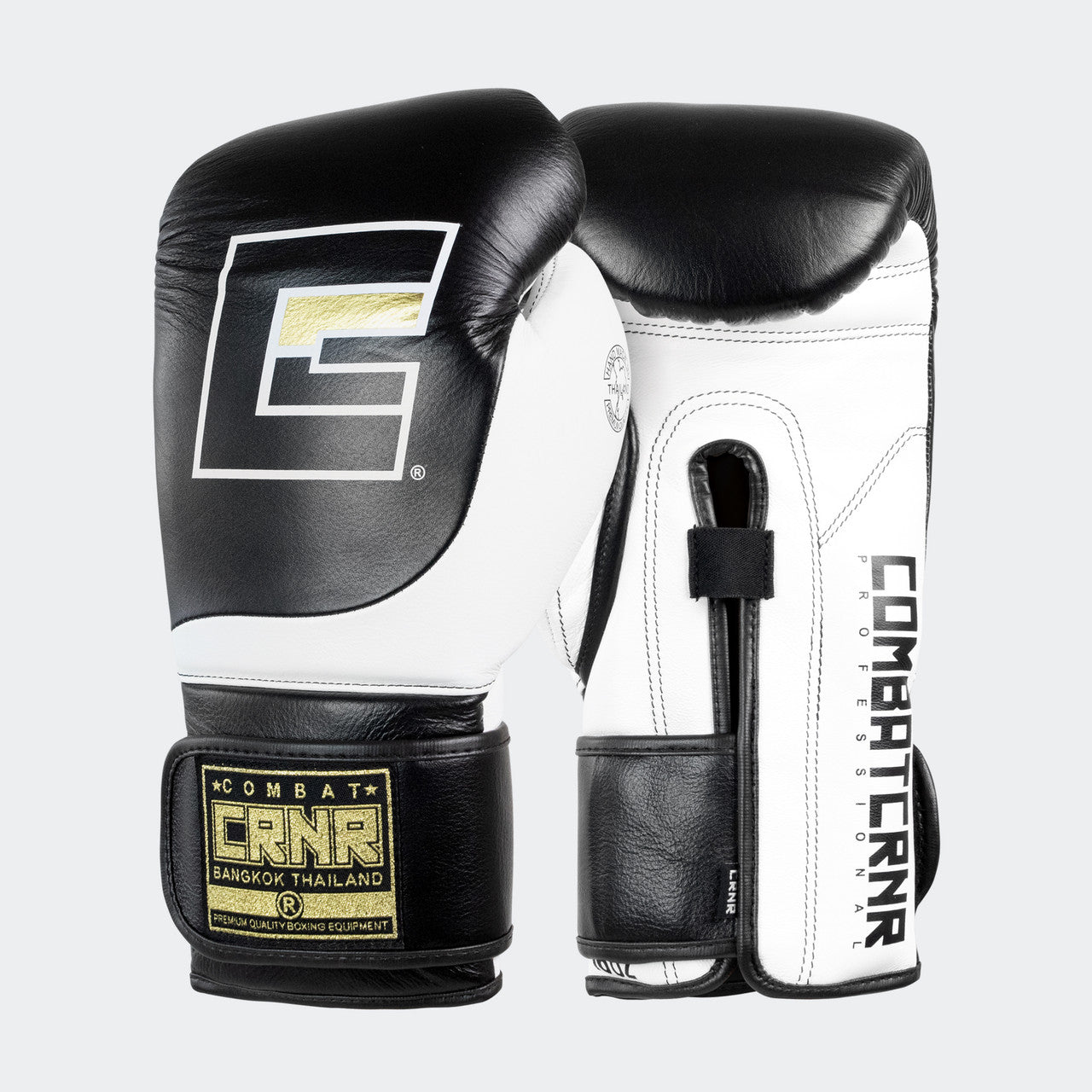 Photo of a pair of Combat Corner's black and white HMIT Velcro Sparring Gloves, which are Mexican Boxing Gloves that are hand made in Thailand.