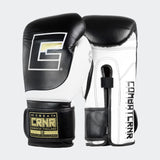 Photo of a pair of Combat Corner's black and white HMIT Velcro Sparring Gloves, which are Mexican Boxing Gloves that are hand made in Thailand.