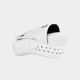 The left side view of the white HMITV Curved Punch Mitts by Combat Corner against a solid light grey background, showcasing the curved hand compartment and front striking surface.