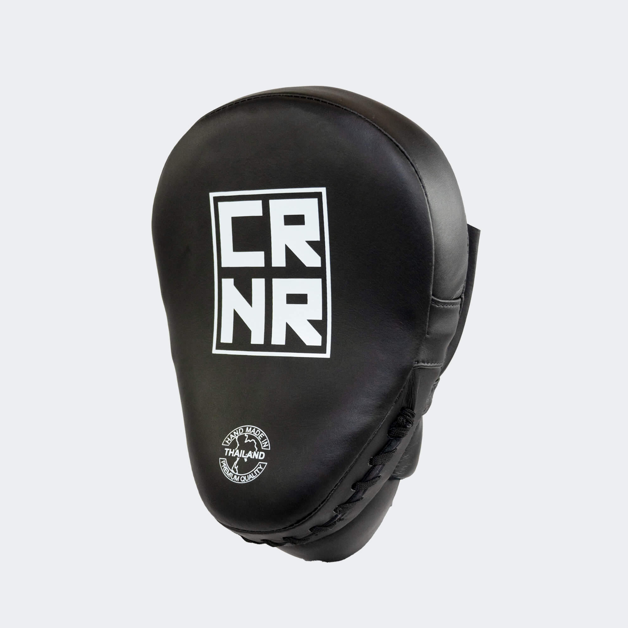 The front of the black HMITV Curved Punch Mitts by Combat Corner against a solid light grey background, showcasing the curved hand compartment and front striking surface.