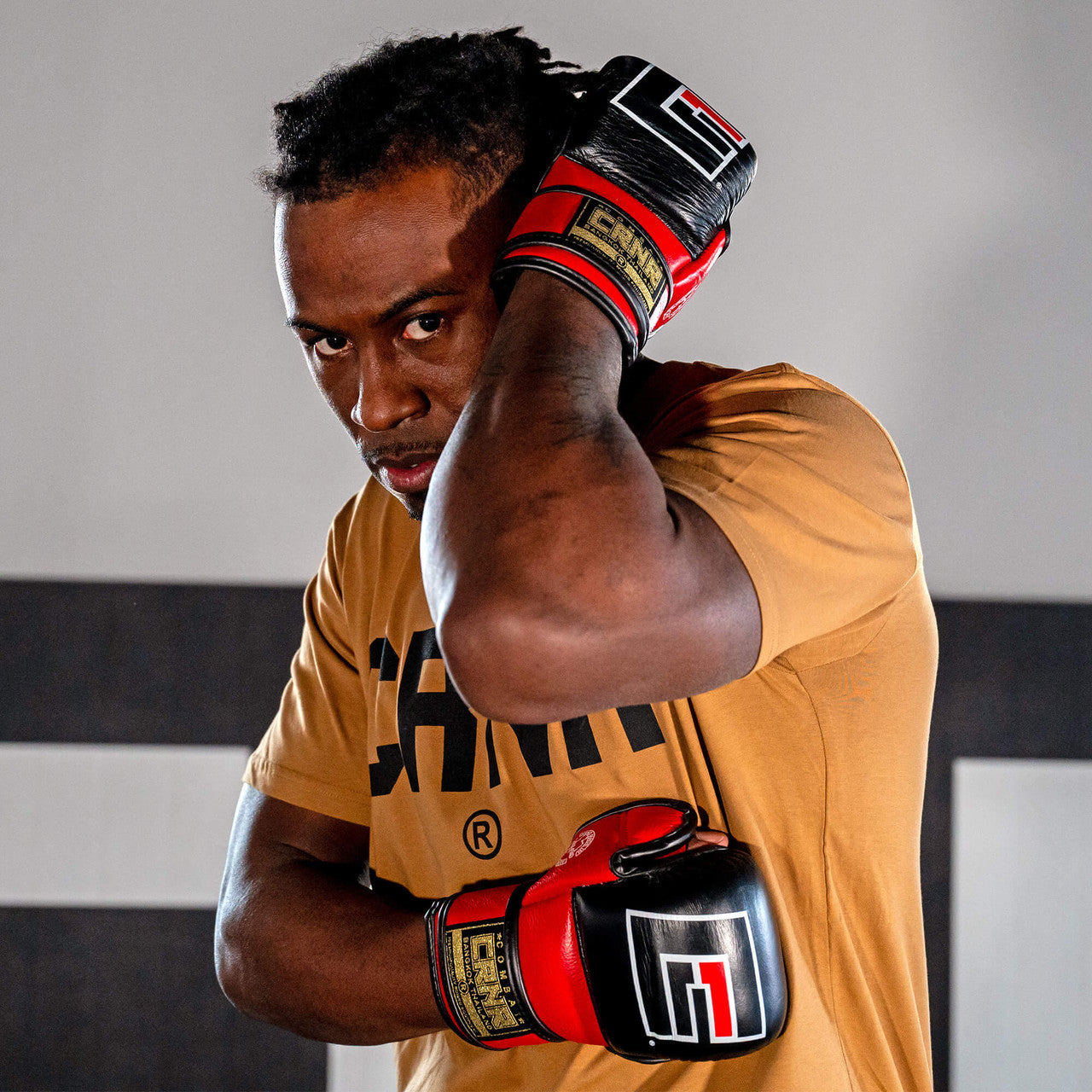 Photo of an athlete training with the red Combat Corner HMIT MMA Training Glove