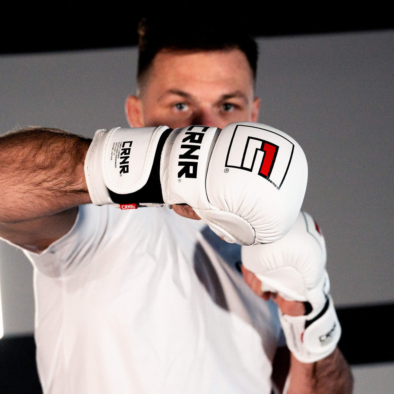 Photo of an athlete sparring with the white Combat Corner Prime MMA Sparring Glove