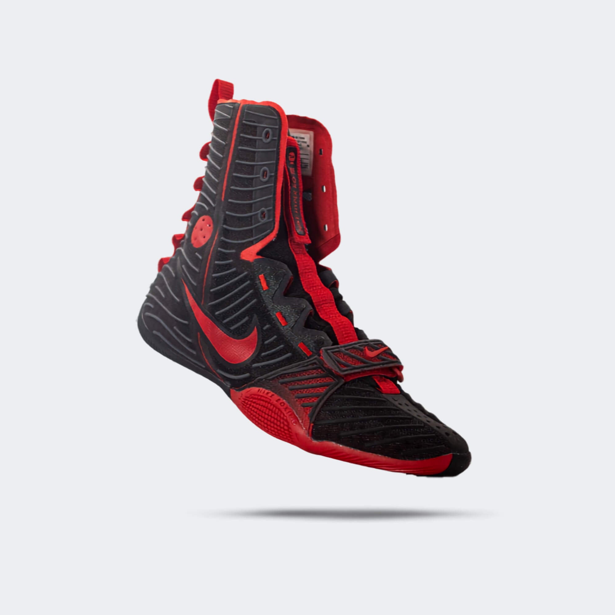 Front-right perspective view of the Nike HyperKO 3 boxing shoe in university black and universal red, available at Combat Corner.