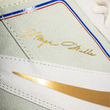Close up detail photo of the Wayne Wells signature on the outsole of the Nike Footsweep 2 wrestling shoe in SE Photon, available from Combat Corner.