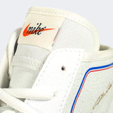 A close up detail photo of the classic Nike tag on the tongue of the Nike Footsweep 2 wrestling shoe in SE Photon, available from Combat Corner.