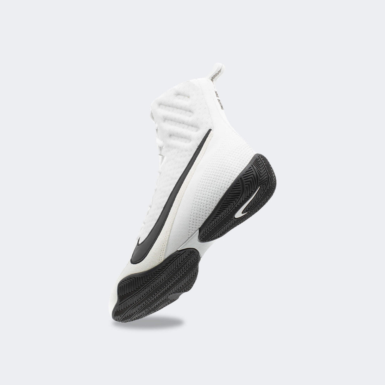 Back-left perspective view of the Nike Machomai 3 boxing shoe in white, available from Combat Corner.