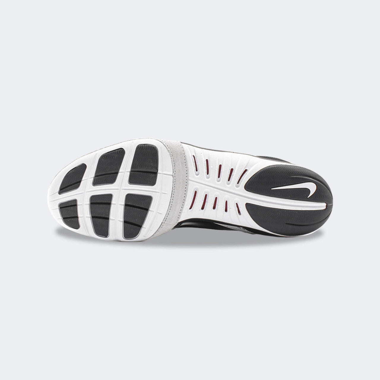 Bottom view showing the rubber outsole and tread pattern of the Nike Freek wrestling shoe in black, available at Combat Corner.