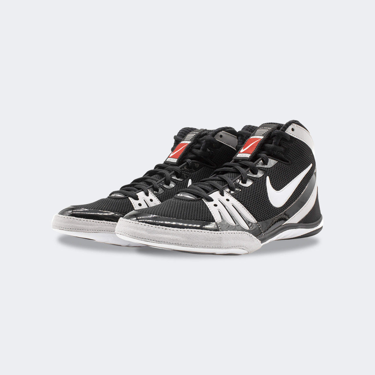 Pair of Nike Freek wrestling shoes in black, viewed from a front-left angle, available at Combat Corner.