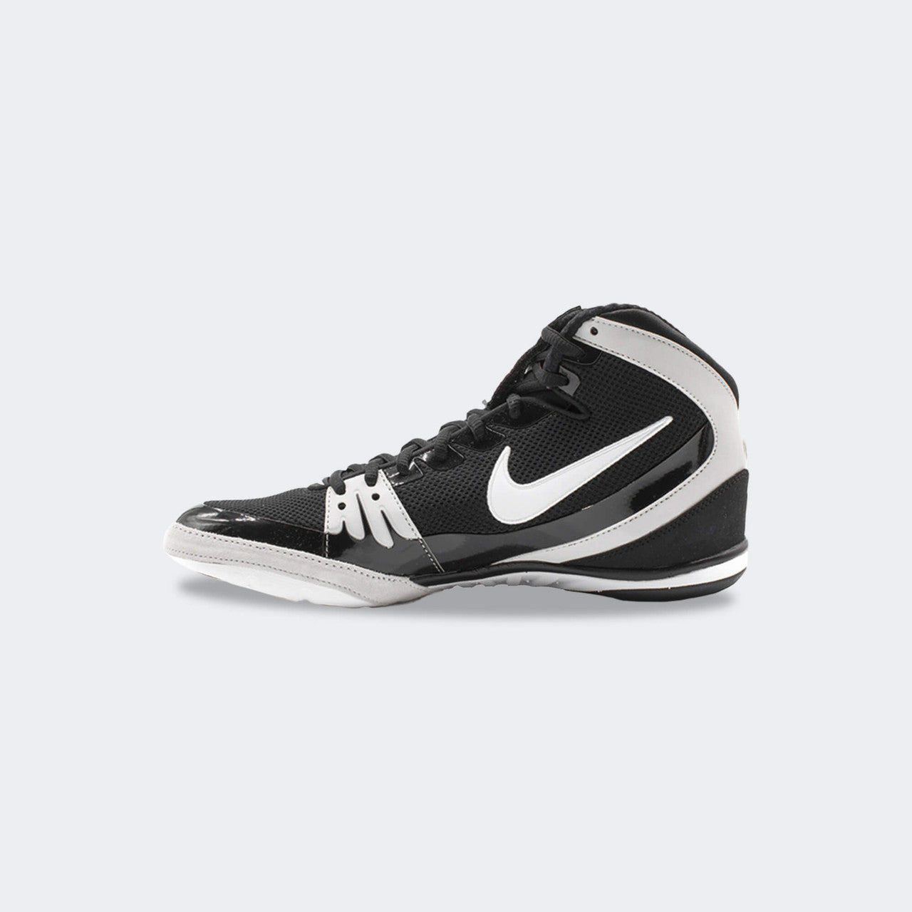 Inner right side view of the Nike Freek wrestling shoe in black, available at Combat Corner.
