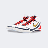 Pair of Nike Freek wrestling shoes in SE white, viewed from a front-left angle, available at Combat Corner.