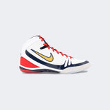 Inner left side view of the Nike Freek wrestling shoe in SE white, available at Combat Corner.