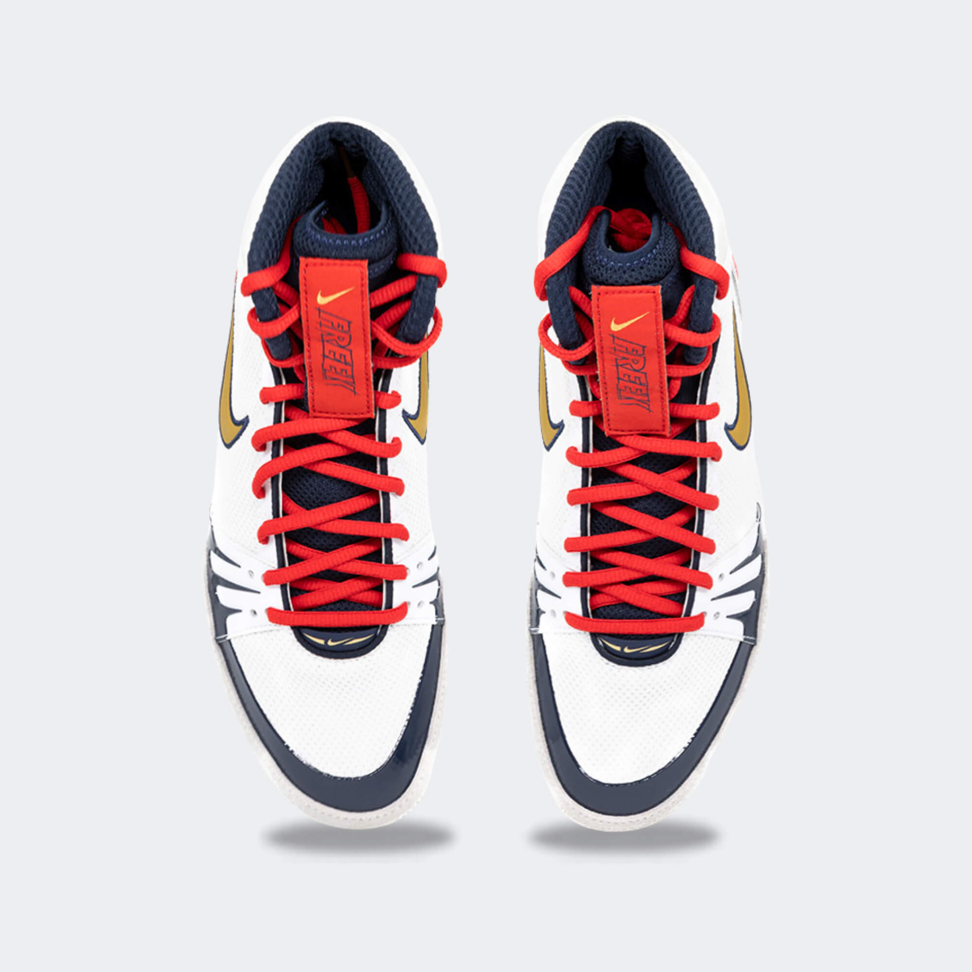 Top down view of a pair of Nike Freek wrestling shoes in SE white, available at Combat Corner.