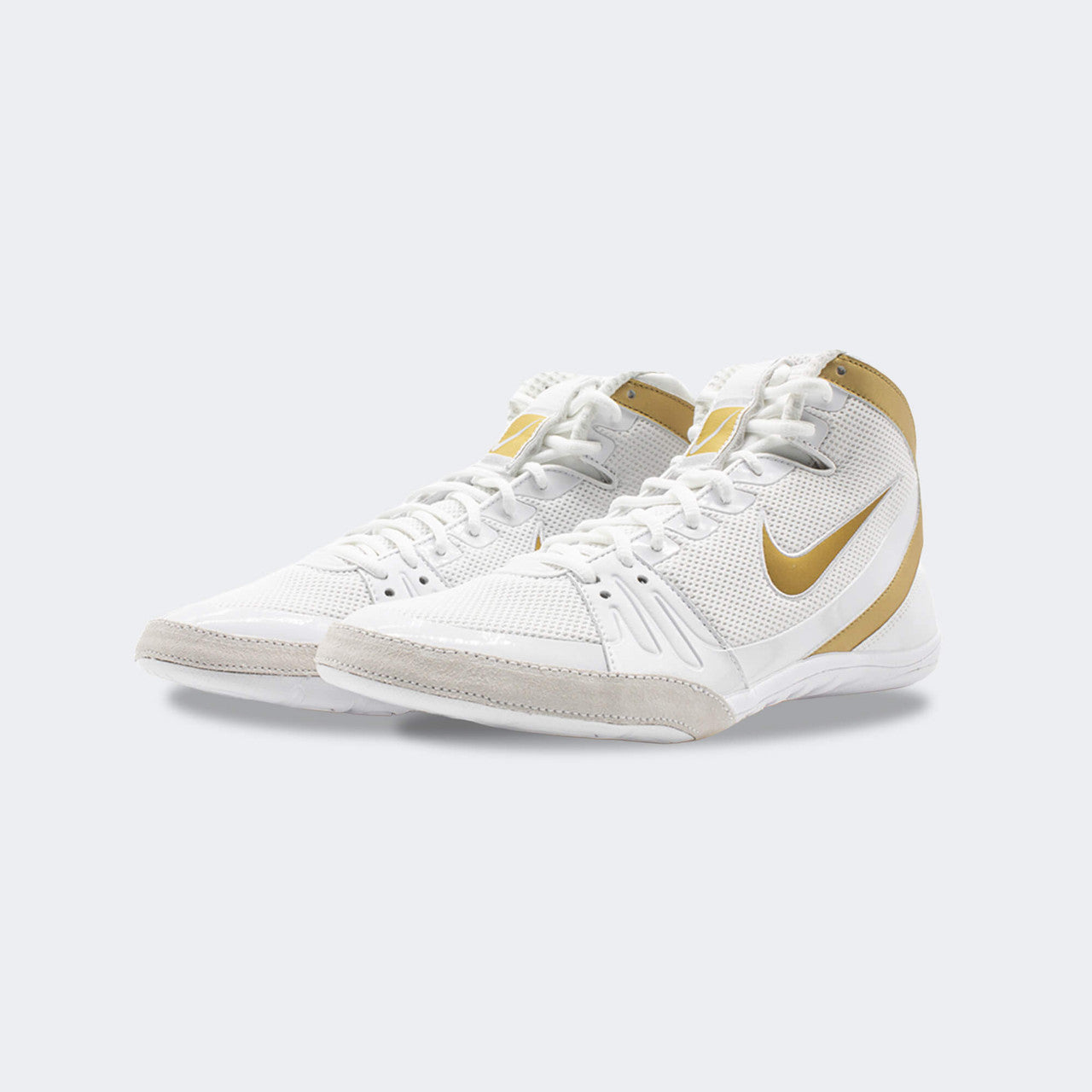 Pair of Nike Freek wrestling shoes in white, viewed from a front-left angle, available at Combat Corner.
