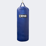 Photo of the front of Combat Corner's blue with black label 150 lbs. Made in the USA Punching Bag.