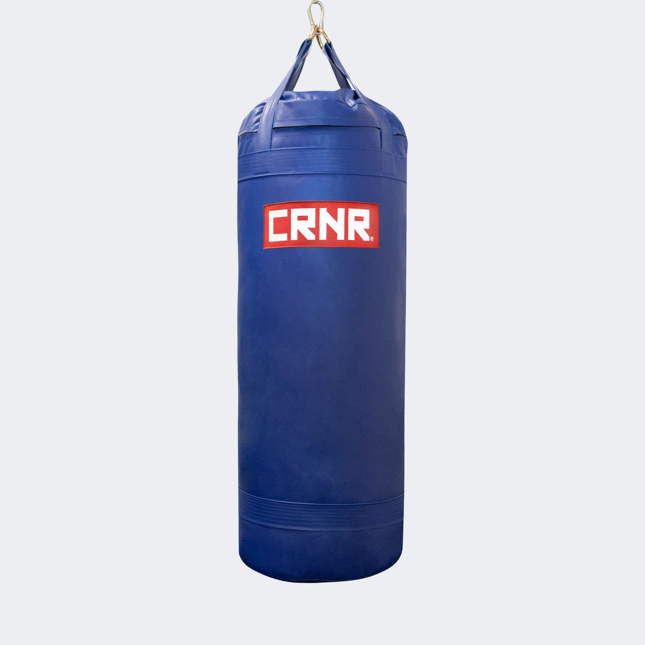 Photo of the front of Combat Corner's blue with red label 150 lbs. Made in the USA Punching Bag.