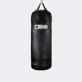 Photo of the front of Combat Corner's black with black label 150 lbs. Made in the USA Punching Bag.