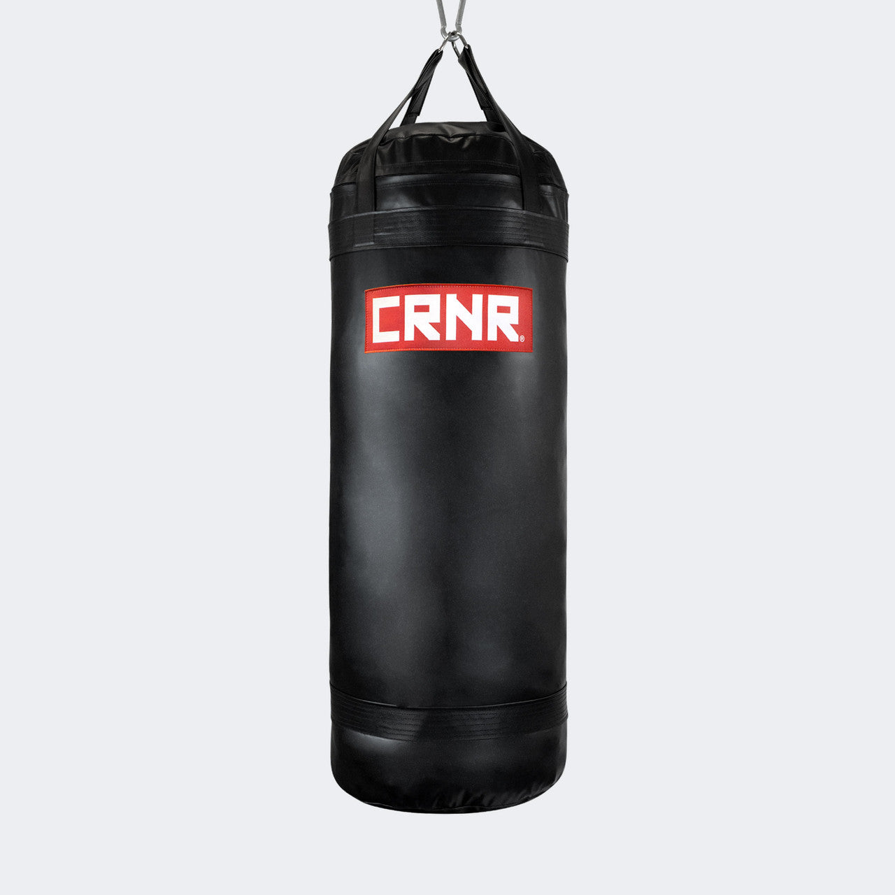 Photo of the front of Combat Corner's black with red label 150 lbs. Made in the USA Punching Bag.
