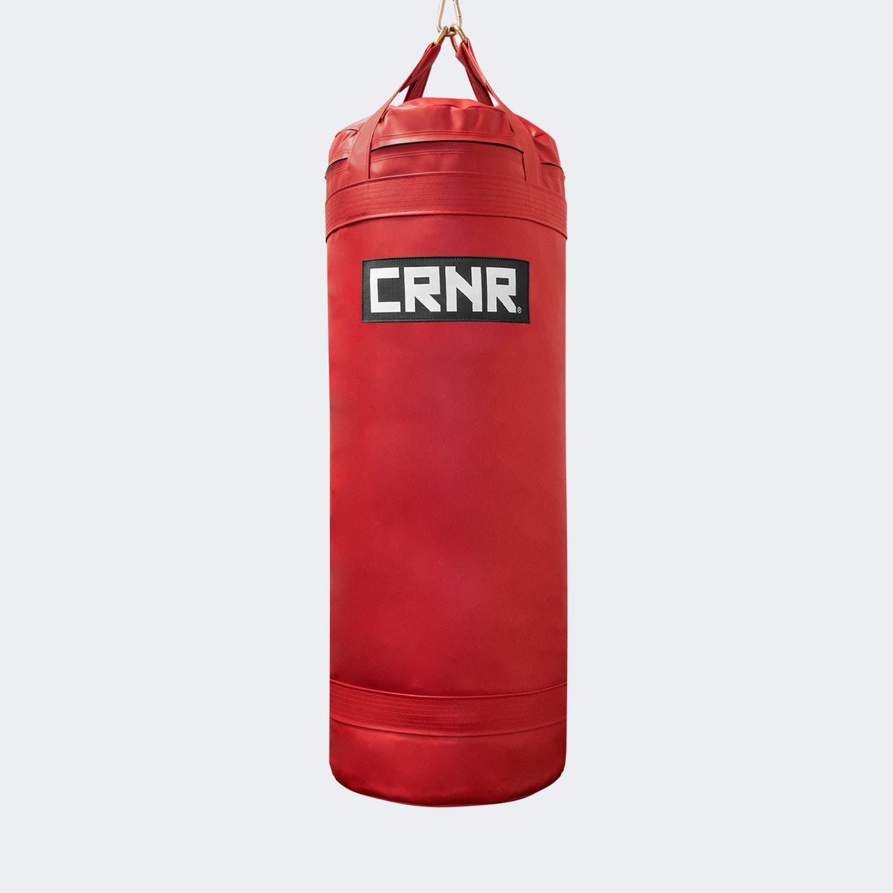 Photo of the front of Combat Corner's red with black label 150 lbs. Made in the USA Punching Bag.