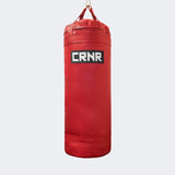 Photo of the front of Combat Corner's red with black label 150 lbs. Made in the USA Punching Bag.