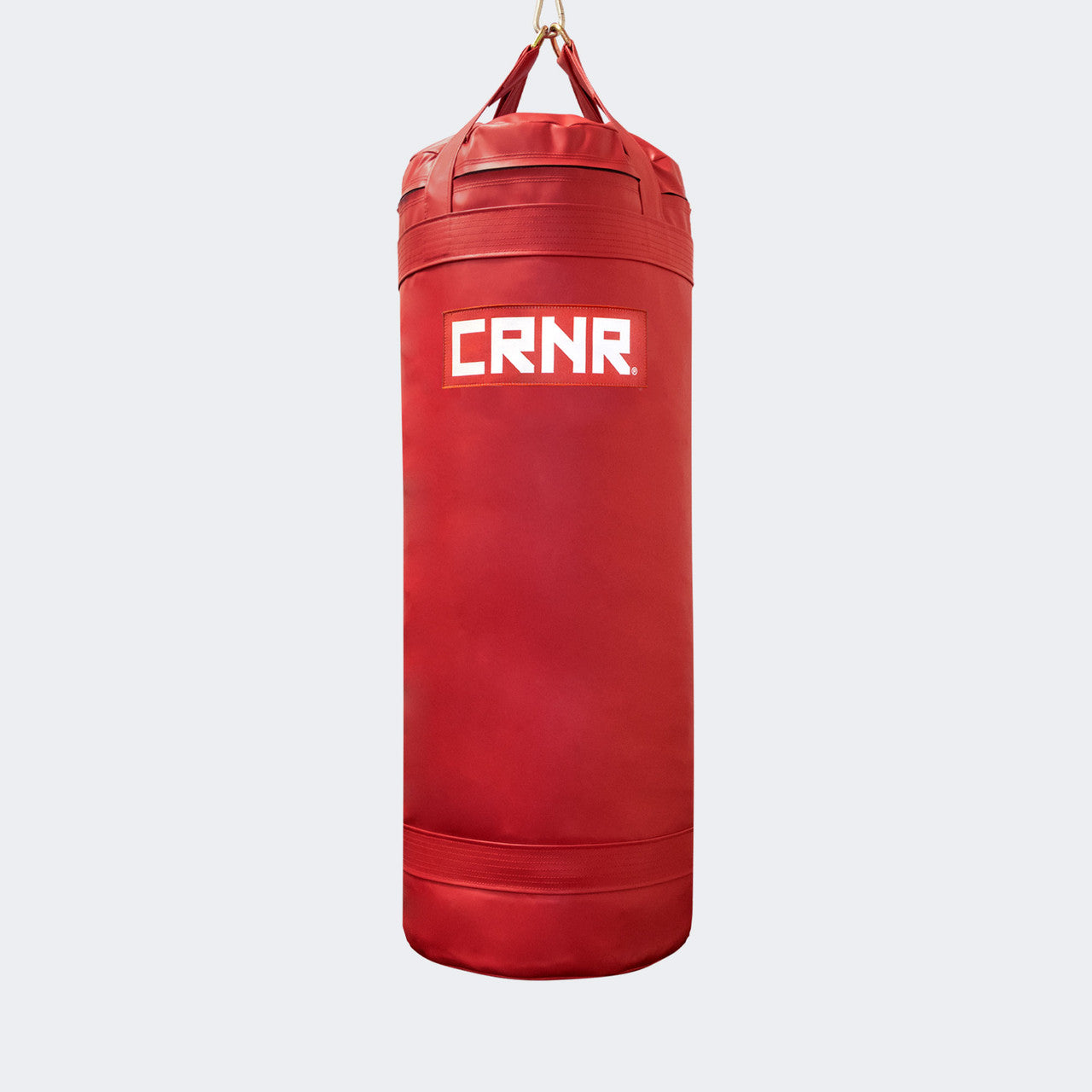 Photo of the front of Combat Corner's red with red label 150 lbs. Made in the USA Punching Bag.