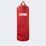Photo of the front of Combat Corner's red with red label 150 lbs. Made in the USA Punching Bag.