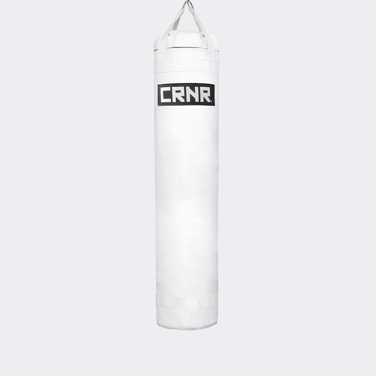 Photo of the front of Combat Corner's white with black label 6 ft., 150 lbs. Made in the USA Punching Bag.