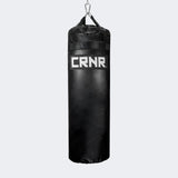 Photo of the front of Combat Corner's black with black label 100 lbs. Made in the USA Punching Bag.
