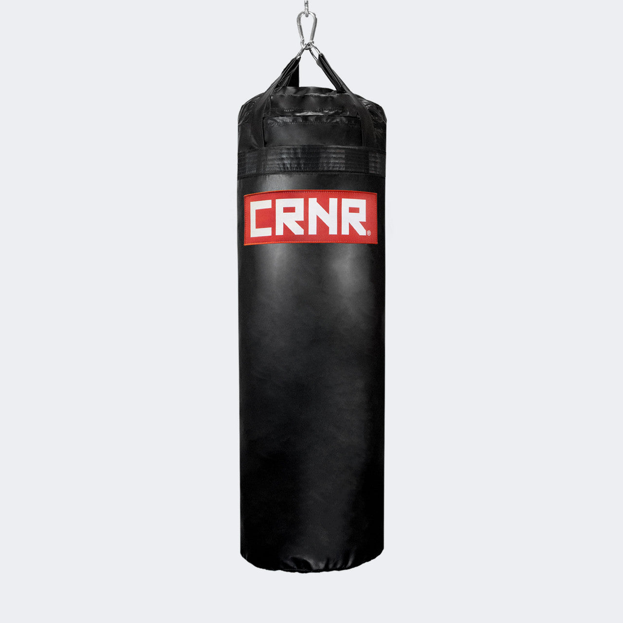Photo of the front of Combat Corner's black with red label 100 lbs. Made in the USA Punching Bag.