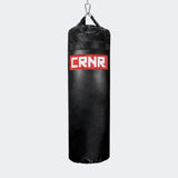 Photo of the front of Combat Corner's black with red label 80 lbs. Made in the USA Punching Bag.