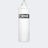 Photo of the front of Combat Corner's white with black label 80 lbs. Made in the USA Punching Bag.